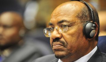 "Omar al-Bashir, 12th AU Summit, 090131-N-0506A-342" by U.S. Navy photo by Mass Communication Specialist 2nd Class Jesse B. Awalt/Released - DefenseImagery.mil, VIRIN 090131-N-0506A-342. Licensed under Public Domain via Wikimedia Commons