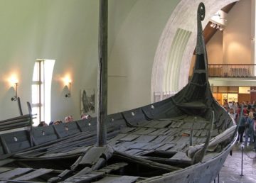 The preserved remains of the Oseberg Ship, now located in the Viking Ship Museum (Oslo). By Hofi0006 - Own work, CC BY-SA 3.0, https://commons.wikimedia.org/w/index.php?curid=268551