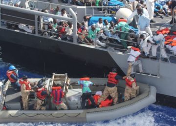Rescued migrants, October 2013. By Official U.S. Navy Page from United States of America U.S. Navy photo/ Public Domain, https://commons.wikimedia.org/w/index.php?curid=30912042 Rescued migrants, October 2013
