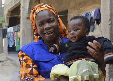 Martha, a former pediatric nurse, travels around northeast Nigeria as part of IOM’s mental health teams. She offers counseling and workshops for adults, and runs games for children. Credit: IOM
