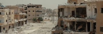 Destroyed neighborhood in Raqqa in August 2017. By Mahmoud Bali (VOA) - US-backed Forces Press Deeper Into Southern Raqqa City, Public Domain, https://commons.wikimedia.org/w/index.php?curid=61719487